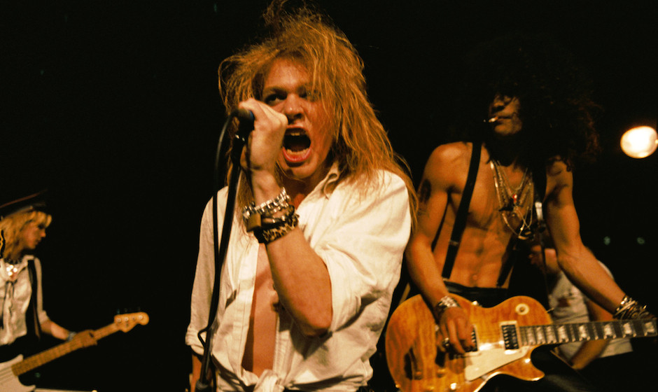 LOS ANGELES - SEPTEMBER 28:  (L-R) Duff McKagan, Axl Rose and Slash of the rock group 'Guns n' Roses' perform at the LA Stree