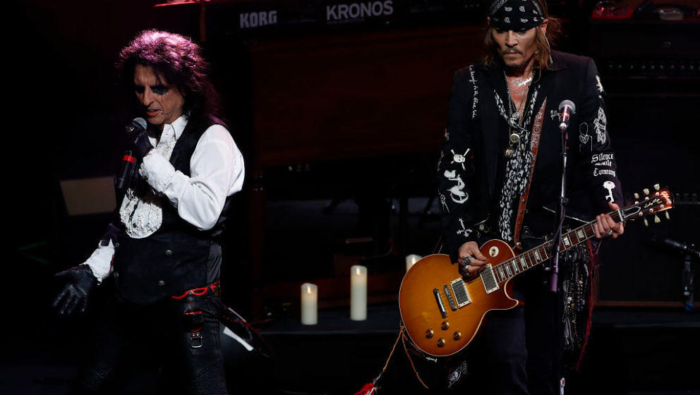 US actor Johnny Depp (R) and singer Alice Cooper perform with The Hollywood Vampires band during the 52th Montreux Jazz Festi