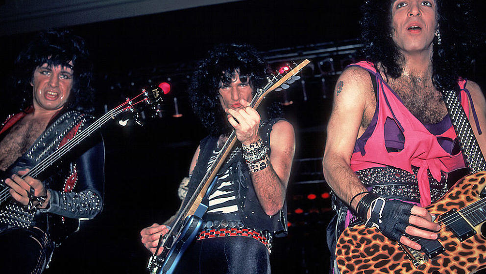 From left, American musicians Gene Simmons, Bruce Kulick, and Paul Stanley of the group Kiss perform at the Mecca Arena, Milw