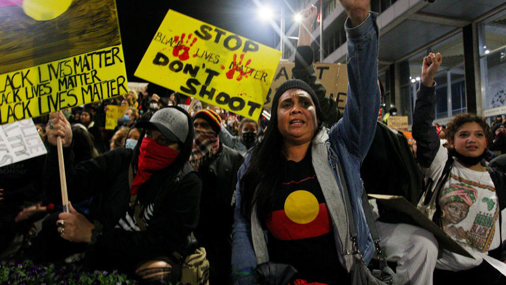 SYDNEY, AUSTRALIA - JUNE 02: Protestors chant and bend down on their knees in Martin Place during a 'Black Lives Matter' rall
