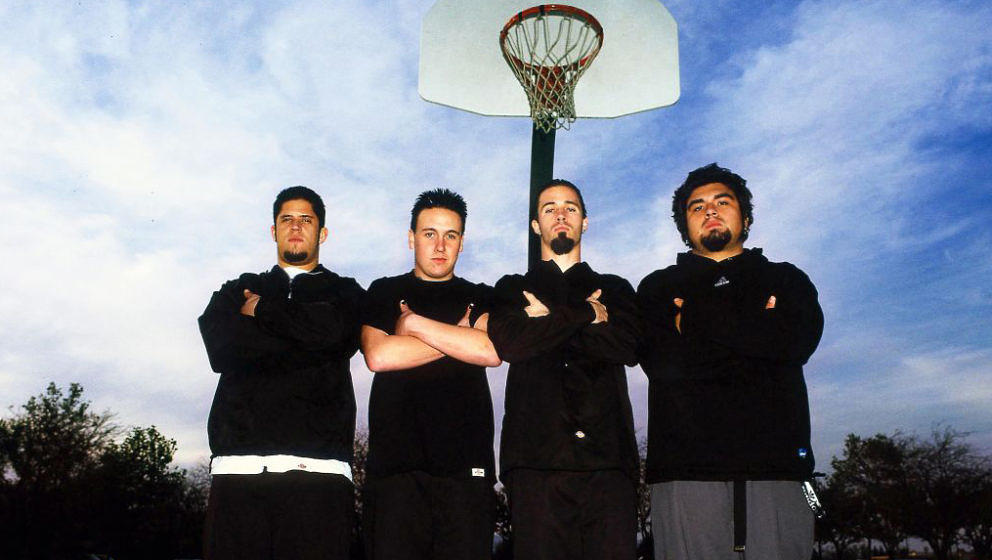 Papa Roach, group portrait on the basketball court of the school they attended, in their home town of Vacaville, California, 