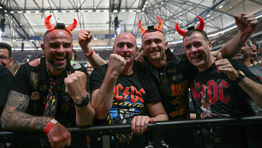 Fans of Australian rock band AC/DC cheers at their 'PowerUp Tour 2024' at the VELTINS-Arena in Gelsenkirchen, western Germany