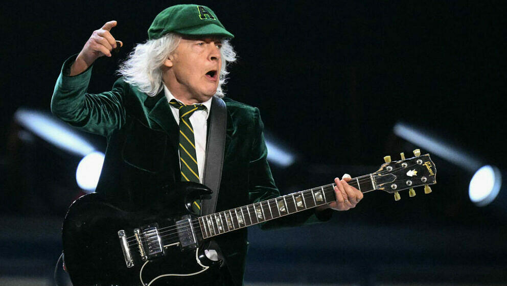 Angus Young, lead guitarist of Australian rock band AC/DC performs on stage during their 'PowerUp Tour 2024' at the VELTINS-A