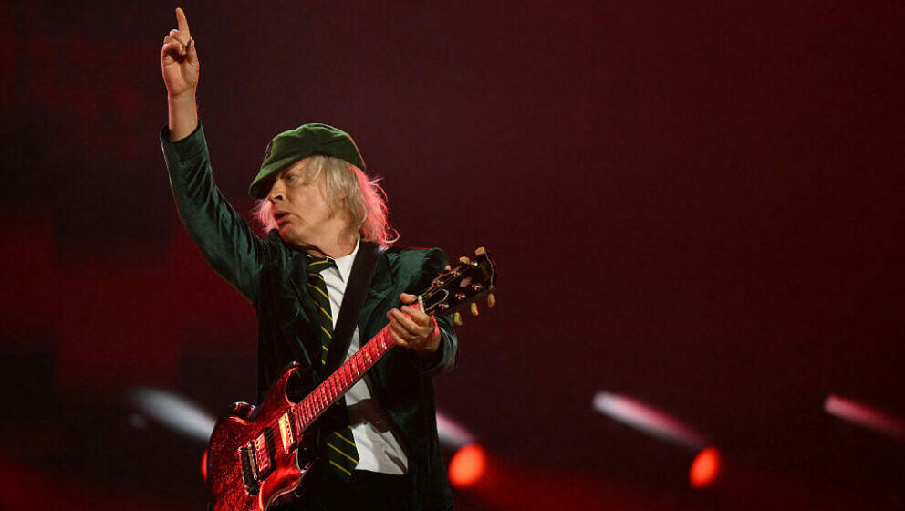 Angus Young, lead guitarist of Australian rock band AC/DC performs on stage during their 'PowerUp Tour 2024' at the VELTINS-A